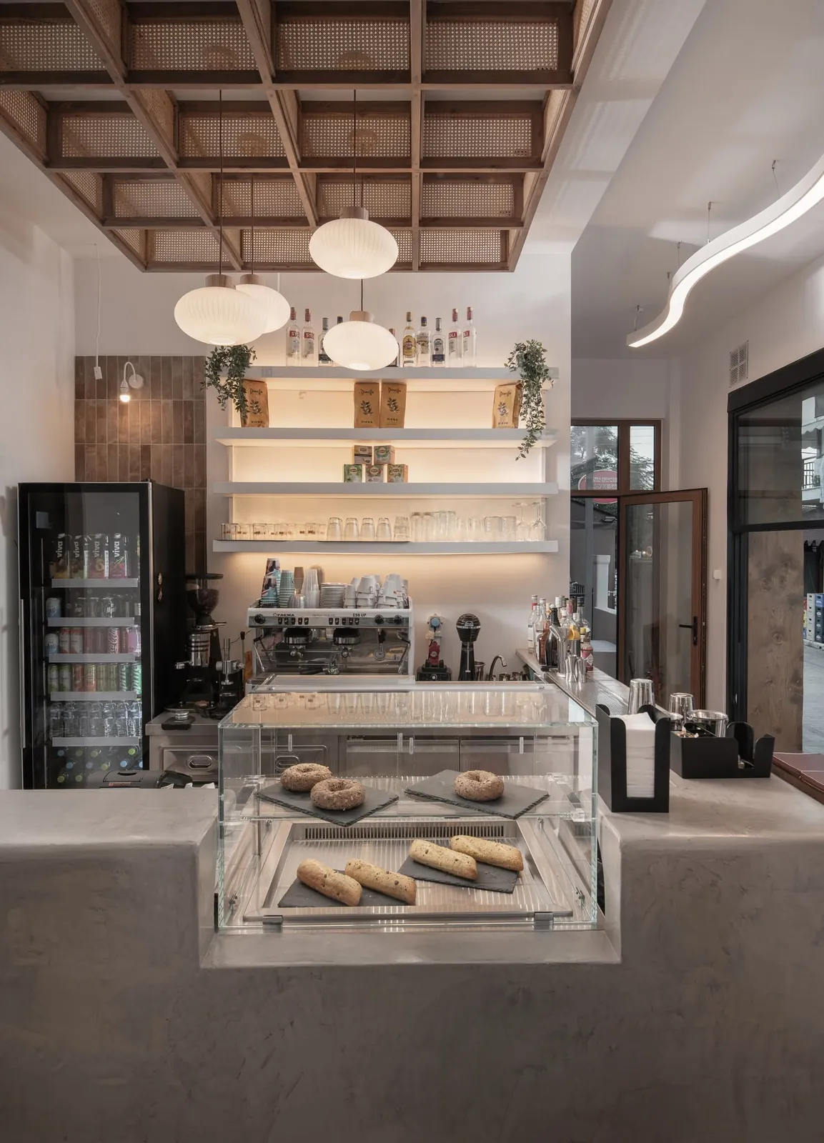The counter with fresh pastries and the coffee machine at Nami