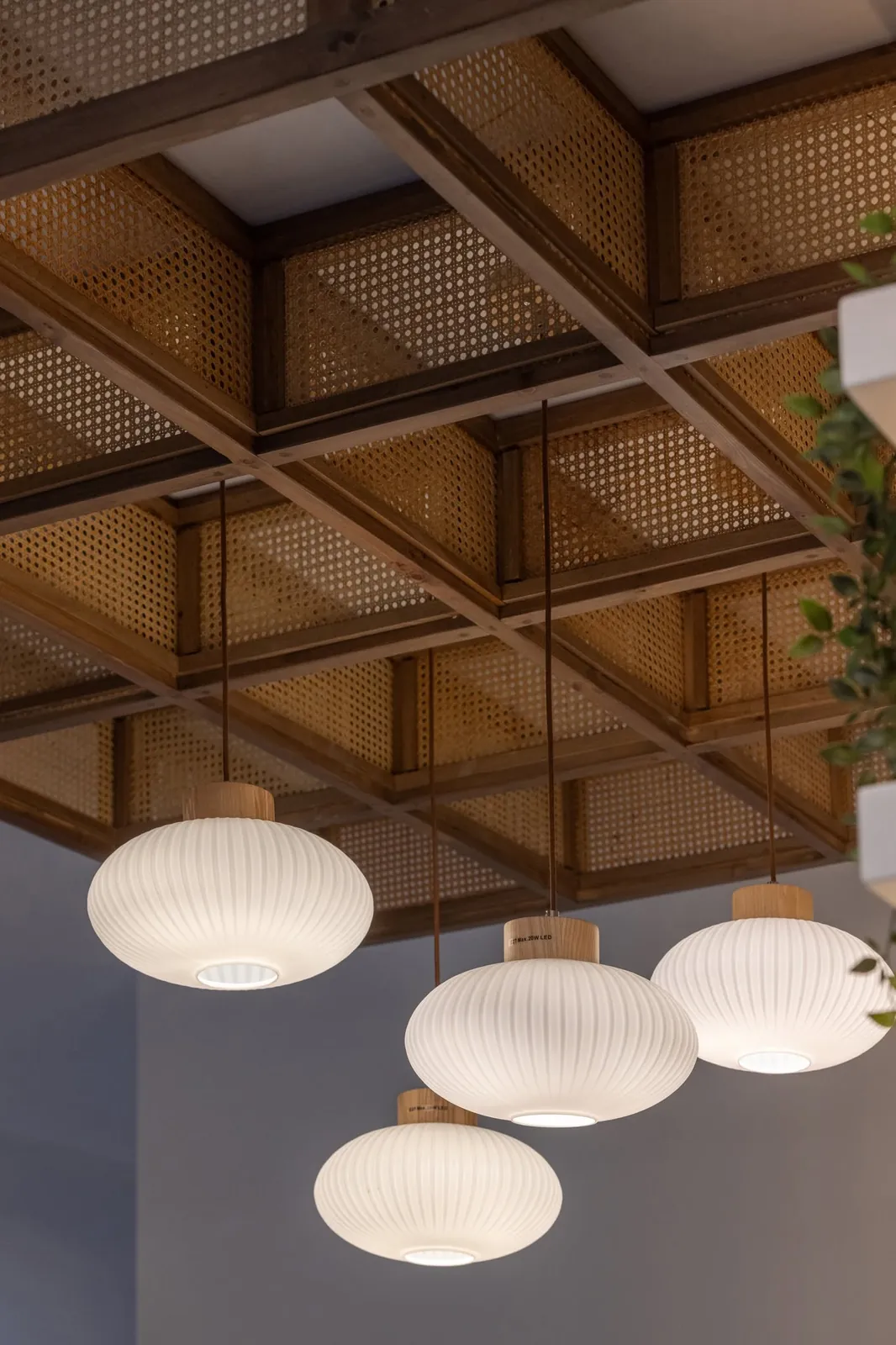 The wooden rattan ceiling and paper lights at Nami
