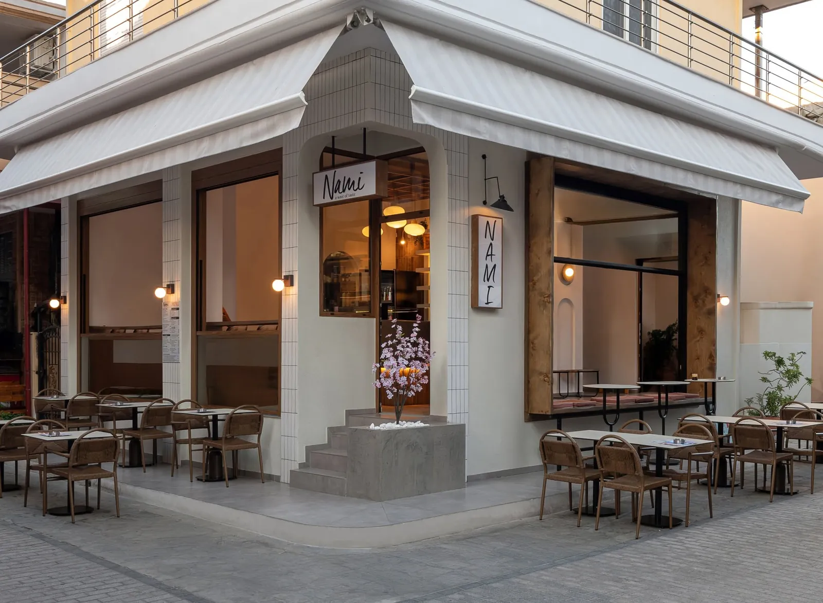 Nami Brunch House on the street corner at dusk